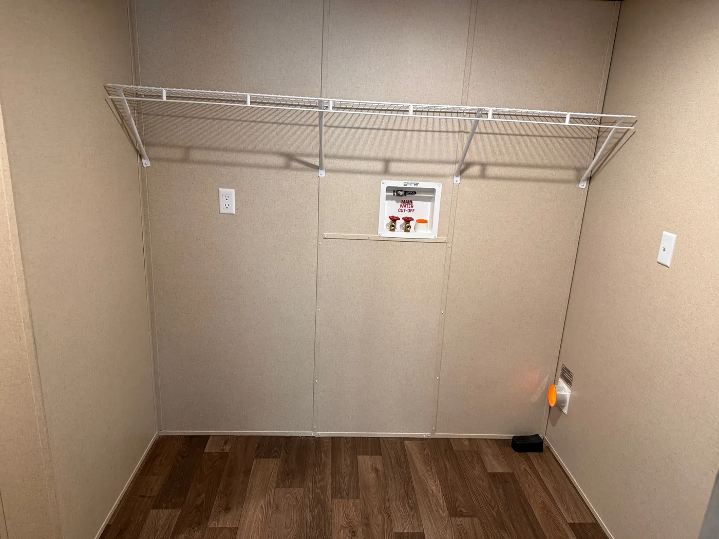 Large area that holds washer dryer, mechanicals and room to add shelves for pantry storage