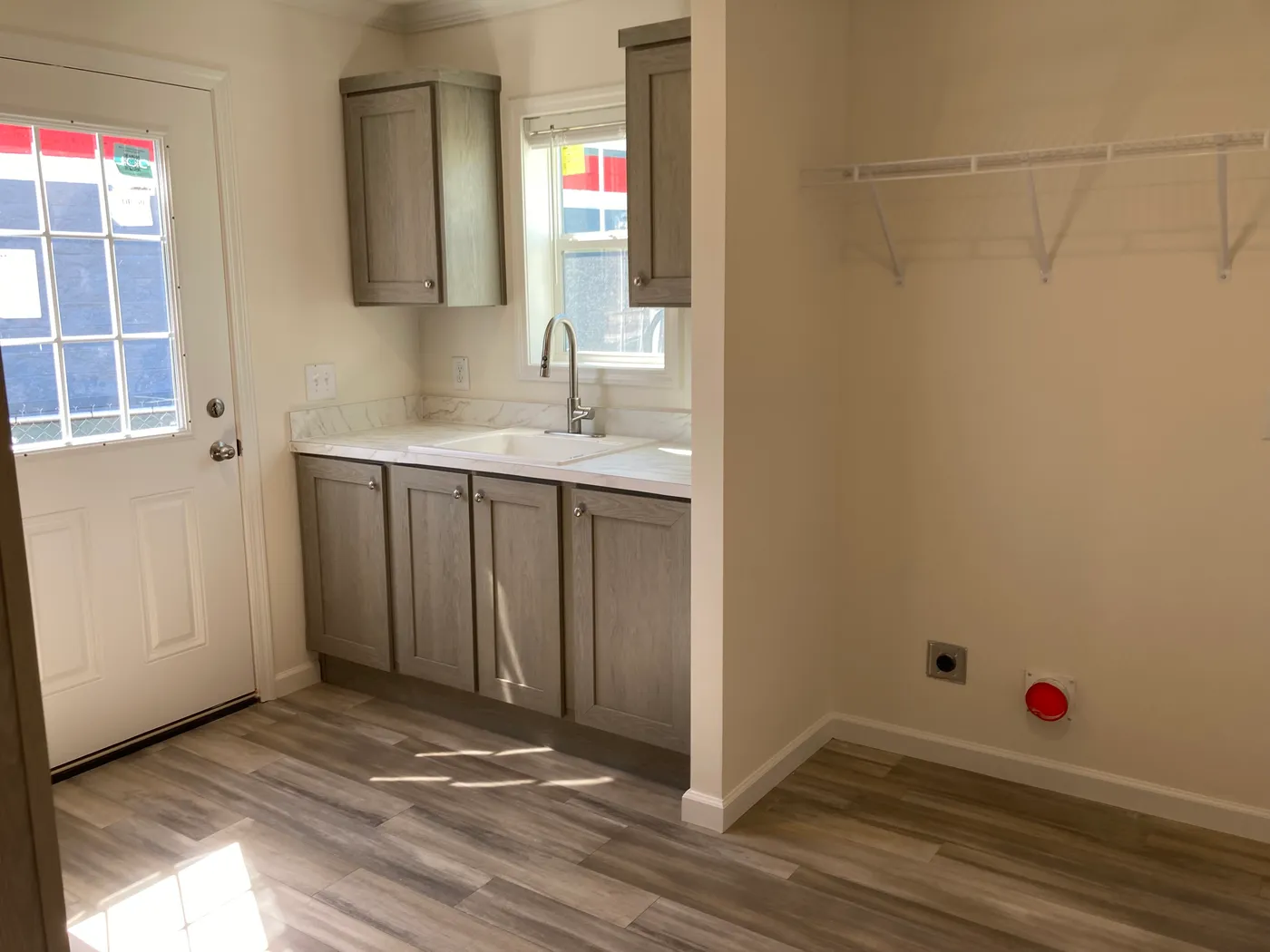 Laundry Room with built-ins, sink and coat rack with cubbies.