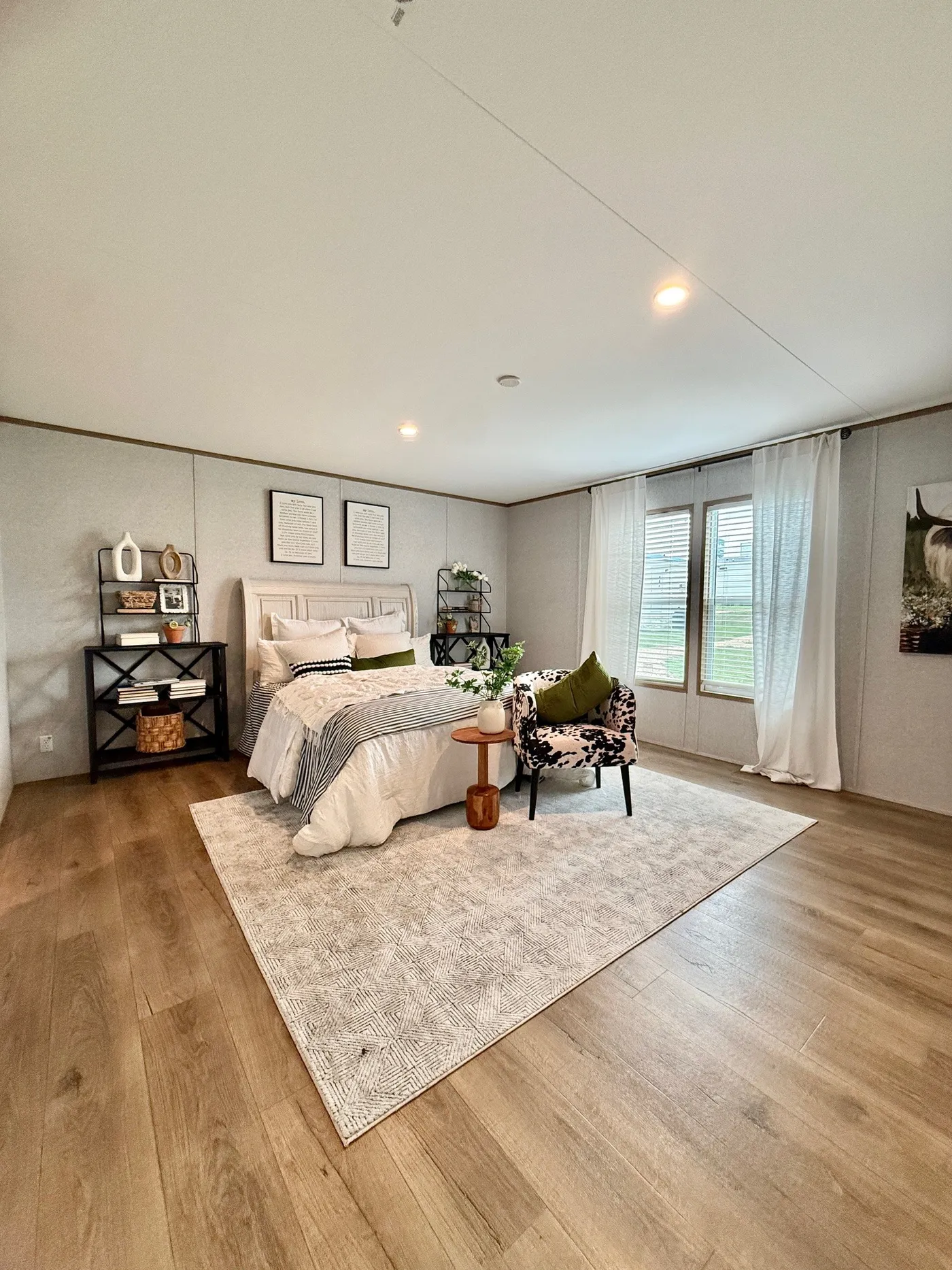 This spacious primary bedroom offers plenty of room to relax and recharge. With large windows bringing in beautiful natural light and a layout that allows for extra seating or décor, this space feels open, calm, and inviting.

The size of this room gives you flexibility to create your own private sanctuary, whether that’s a cozy reading corner or a quiet place to unwind after a long day.