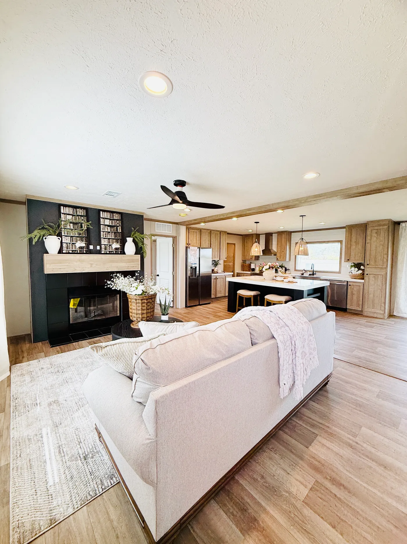 The spacious layout, warm flooring, and stunning fireplace accent wall give the room a welcoming feel while still offering plenty of room for everyone.

*Large open living area
*Beautiful fireplace focal point
*Seamless flow into kitchen and dining
*Perfect for entertaining or family time

It’s the kind of space that makes a house truly feel like home.