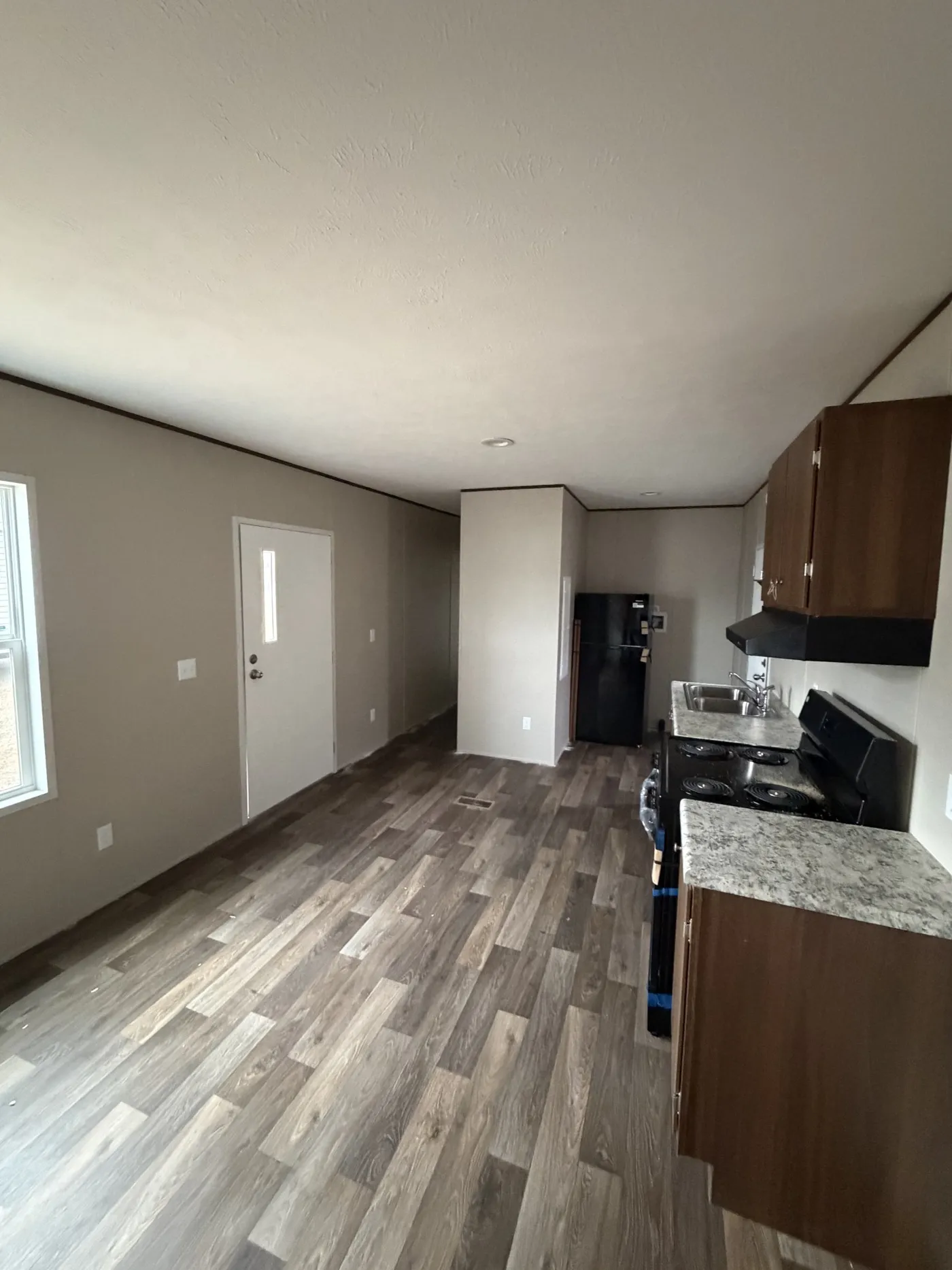 Fridge Option and Space for Stacked Washer/Dryer beside.