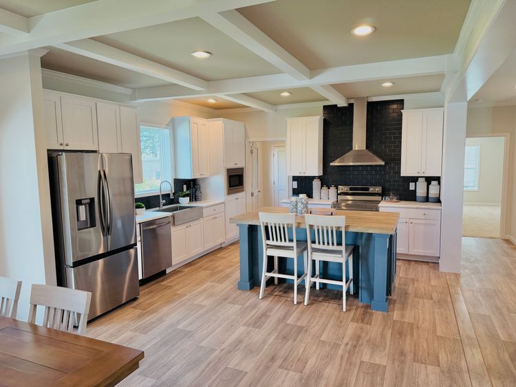 Stainless Range Hood, Samsung Appliances, Coffered Ceilings, Recessed LED Lighting, Tile Backsplash, Single Bowl Stainless Steel Farm Sink, Accent Kitchen Island