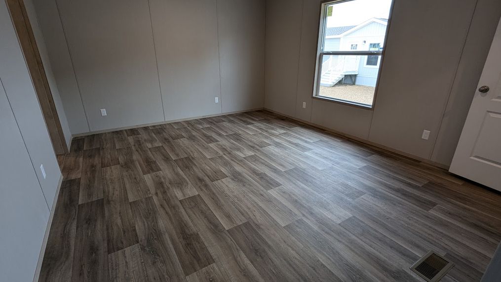 Spacious primary bedroom with walk in closet