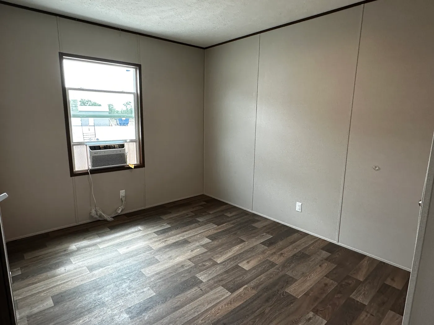 Discover the most affordable and spacious 4 bedroom, 2 bath doublewide manufactured home on the market! This budget-friendly mobile home features elevated ceilings, an open-concept layout, and plenty of room to grow with both a living room and separate den—perfect for entertaining, relaxing, or family space. The modern kitchen includes a large center island with ample storage and workspace. The private primary suite offers a walk-in closet, plus a luxury separate soaking tub and walk-in shower f