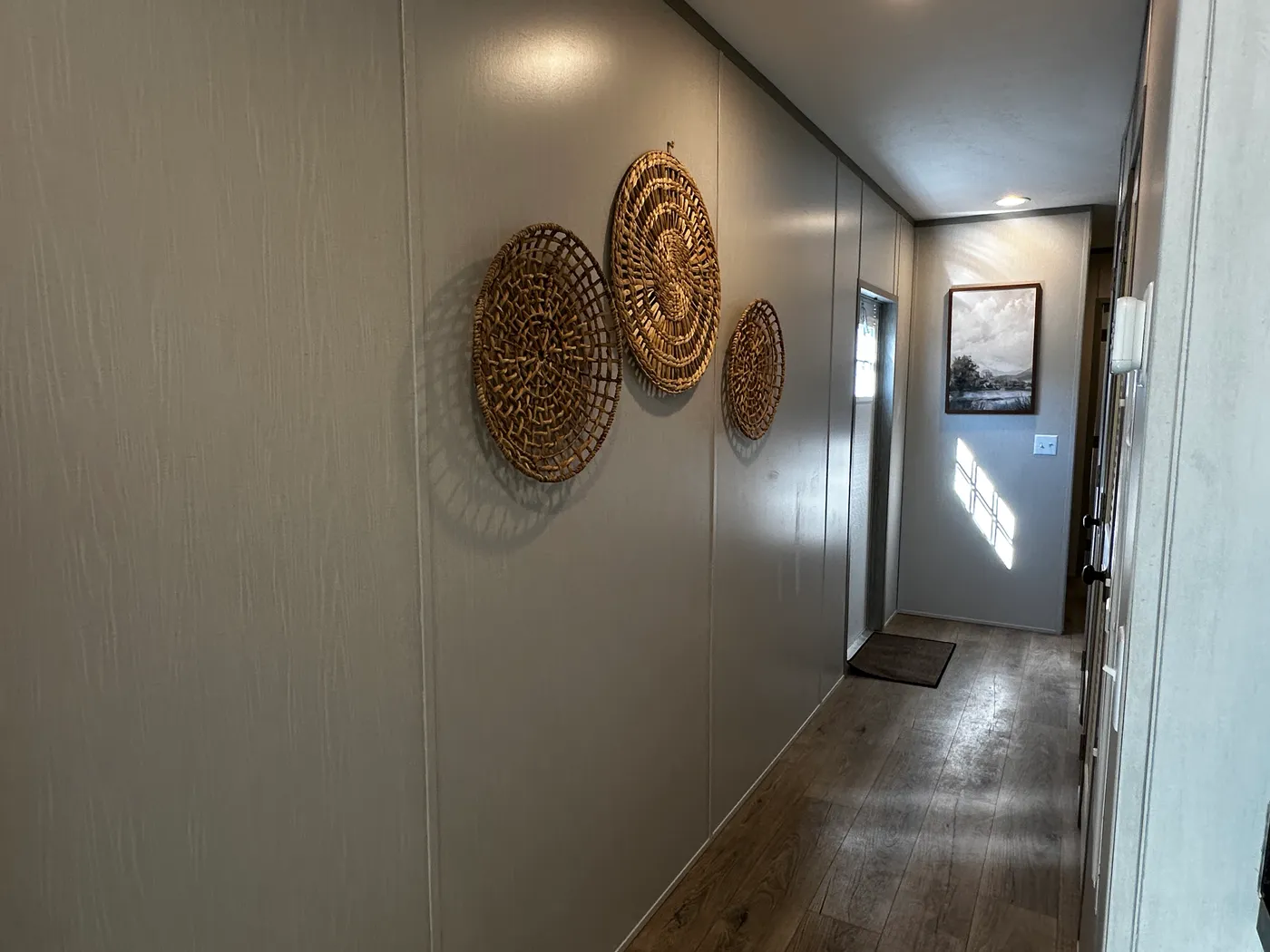 Discover this luxury porch model manufactured home featuring 2 bedrooms, 2 bathrooms, and high-end finishes designed for comfort and style. This modern manufactured home offers an open floor plan, stainless steel appliances, and a huge kitchen island perfect for entertaining. The spacious suite includes a walk-in closet and a large tiled low-profile walk-in shower for a spa-like feel. Built for durability and long-term value, this home features SmartPanel siding with a 50-year warranty, a 25-yea