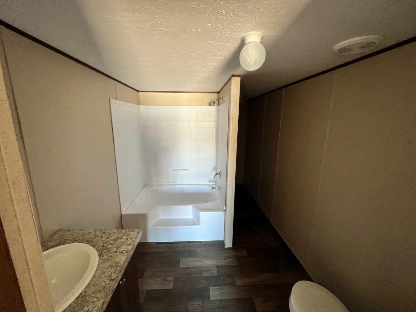 spacious closet behind tub and shower