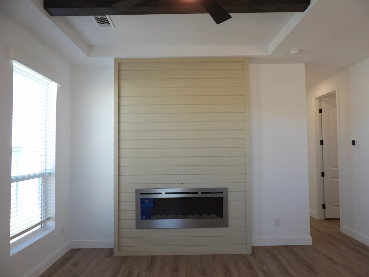 Living Room Accent Wall with Cozy Fireplace