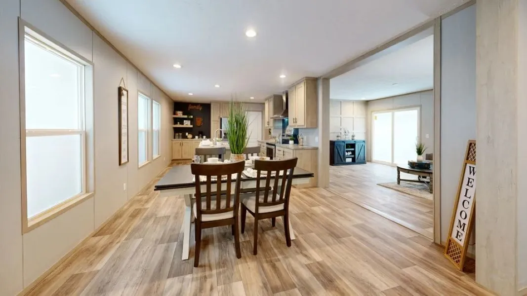 The jaw-dropping open-concept layout immediately welcomes you into a bright, airy Great Room. The space flows effortlessly into a chef-inspired kitchen that serves as the ultimate gathering spot. Featuring a massive central prep island, a dedicated coffee bar, sleek cabinetry, and optional premium stainless-steel appliances, this kitchen is as functional as it is beautiful. Adjacent to the kitchen, a generous dining area is ready for everything from quick morning breakfasts to festive holiday di