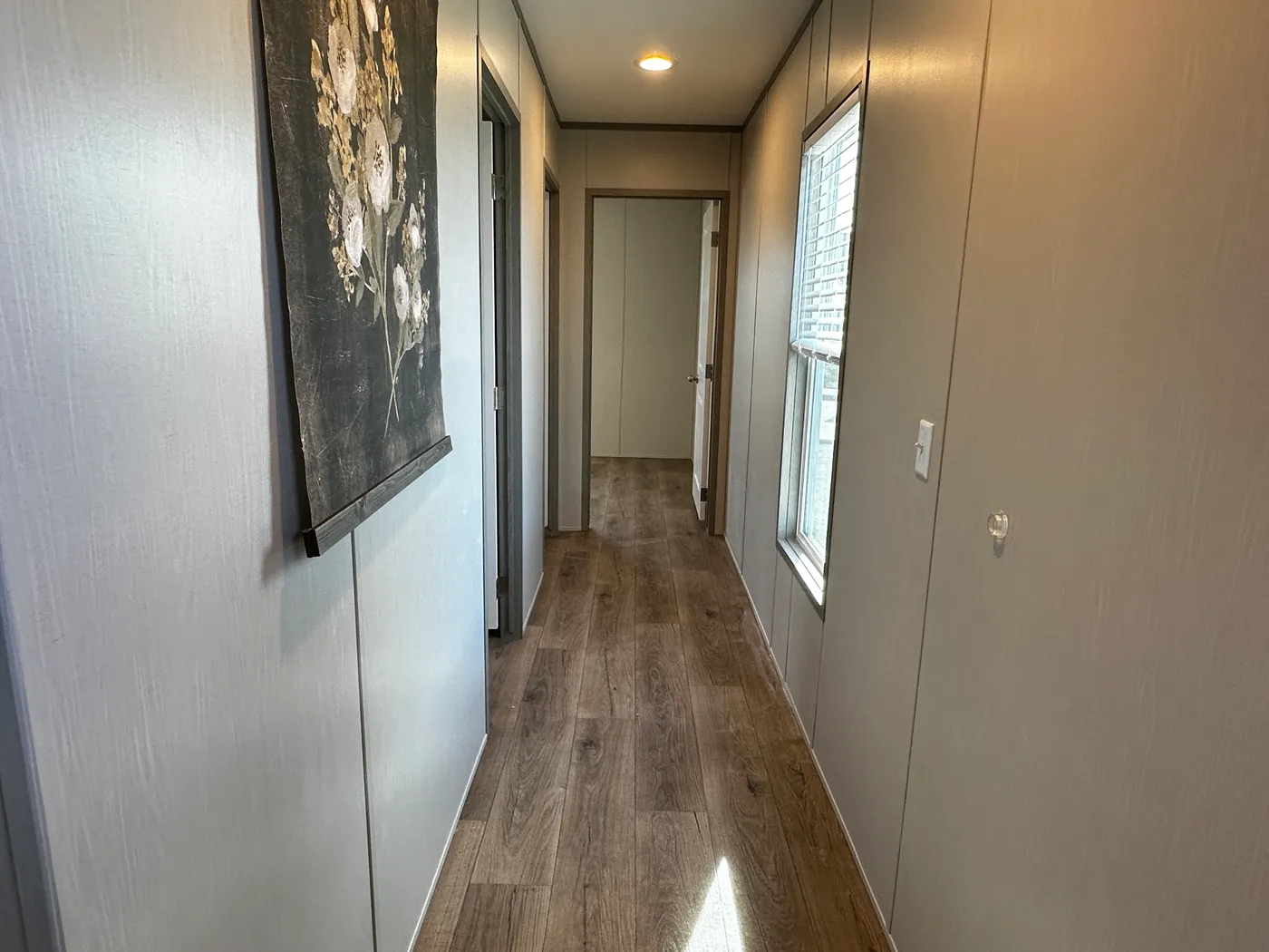 Affordable luxury meets modern comfort in this 3 bedroom, 2 bathroom manufactured home designed for spacious living and energy efficiency. The open-concept layout features a stylish kitchen with stainless steel appliances and a large walk-in pantry for extra storage. The private primary suite includes a generous walk-in closet and a relaxing retreat feel. Enjoy improved comfort with ceiling air vents for better airflow and temperature control throughout the home. This energy-efficient home offer