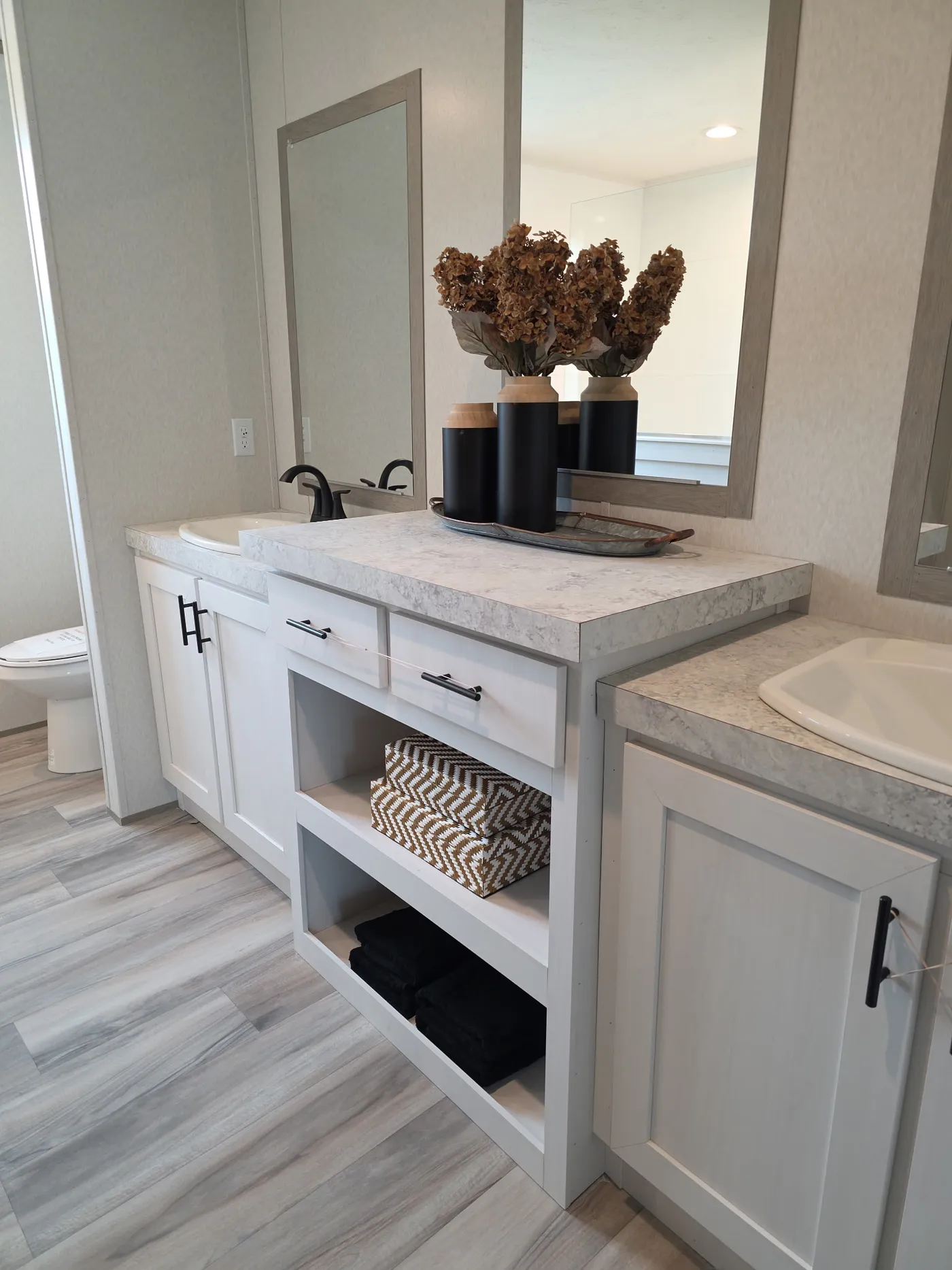 Double sinks with center storage. 