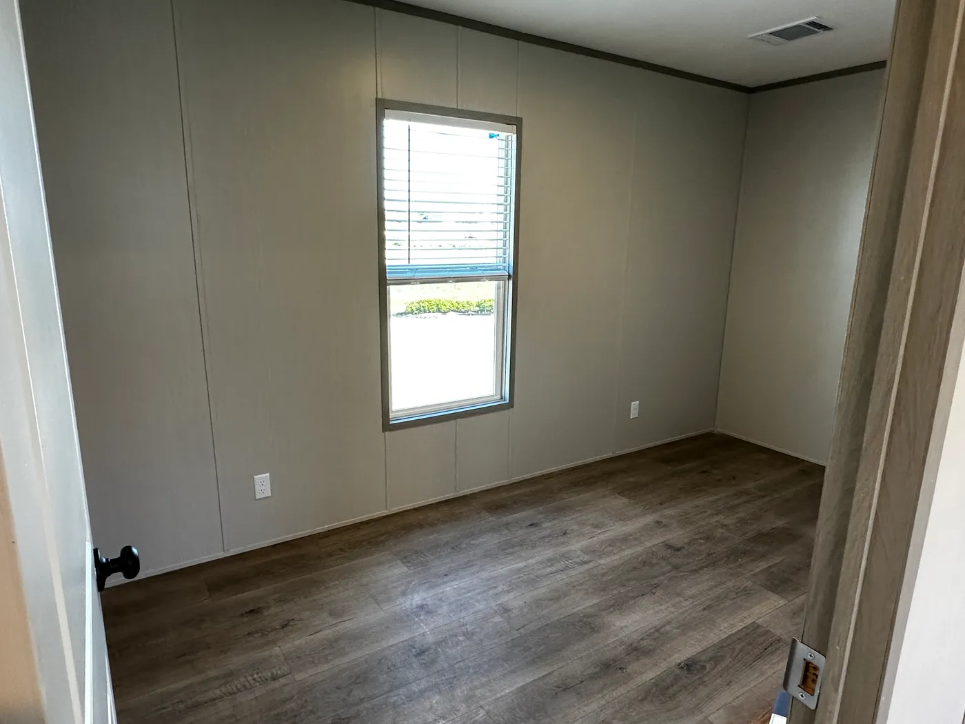 Discover this luxury porch model manufactured home featuring 2 bedrooms, 2 bathrooms, and high-end finishes designed for comfort and style. This modern manufactured home offers an open floor plan, stainless steel appliances, and a huge kitchen island perfect for entertaining. The spacious suite includes a walk-in closet and a large tiled low-profile walk-in shower for a spa-like feel. Built for durability and long-term value, this home features SmartPanel siding with a 50-year warranty, a 25-yea