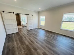 Spacious Primary Bedroom with Sliding Barndoors to the bathroom 