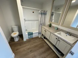 Shower / Tub combo. Storage under vanity. Directly next to an exterior entry