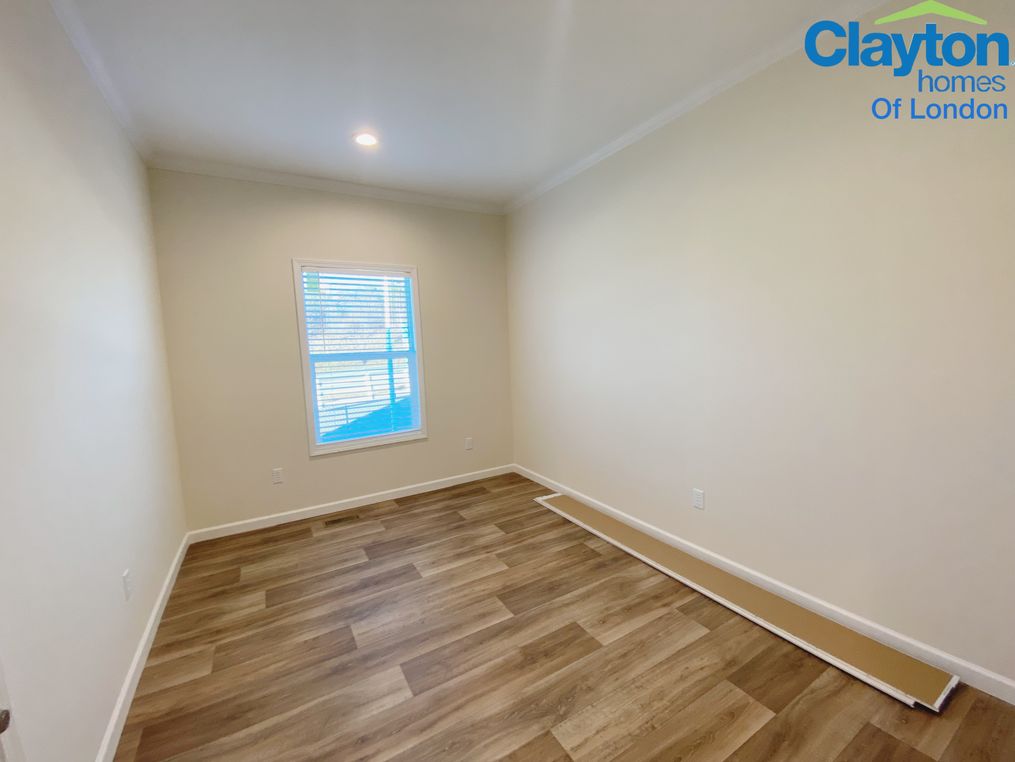 Spacious closet, and vinyl flooring.