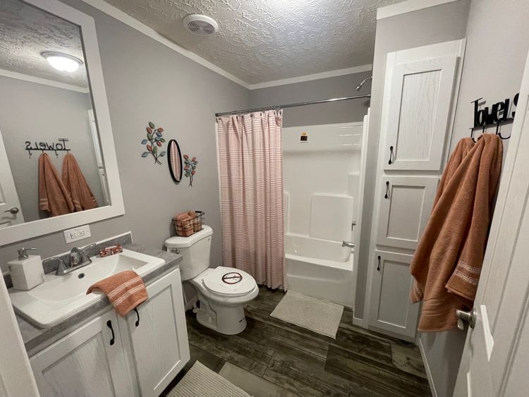 Guest Bathroom features spacious, fiberglass tub and shower combo!