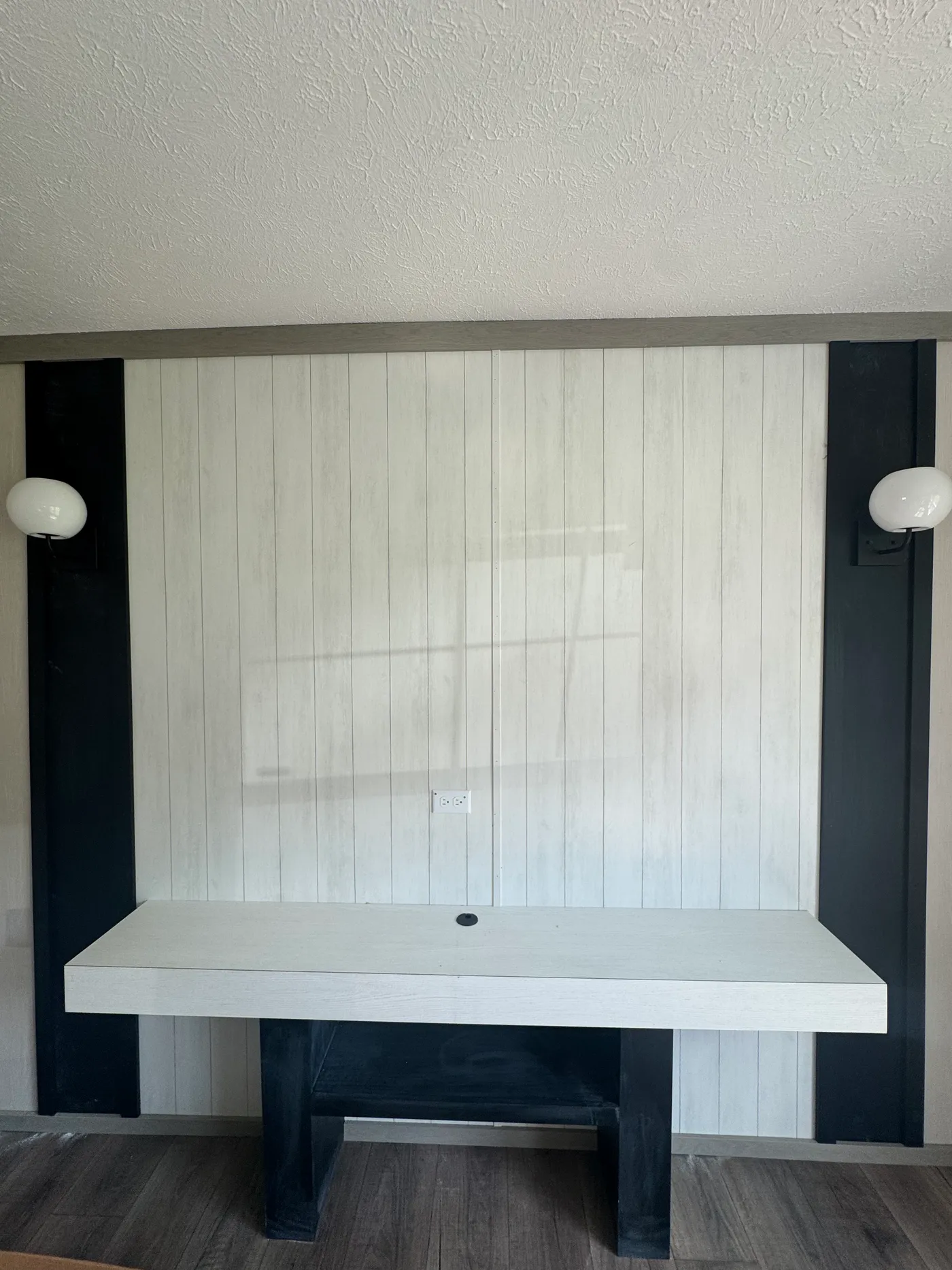 Entertainment wall with sconce lights. 