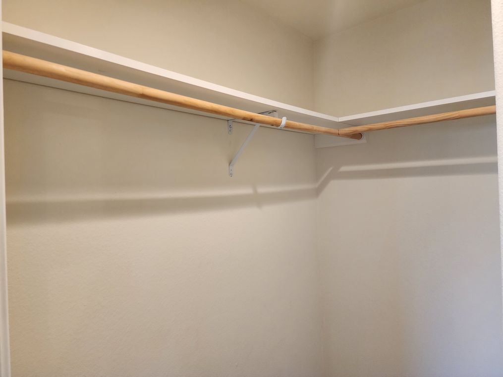 Overhead shelves in primary closet.
