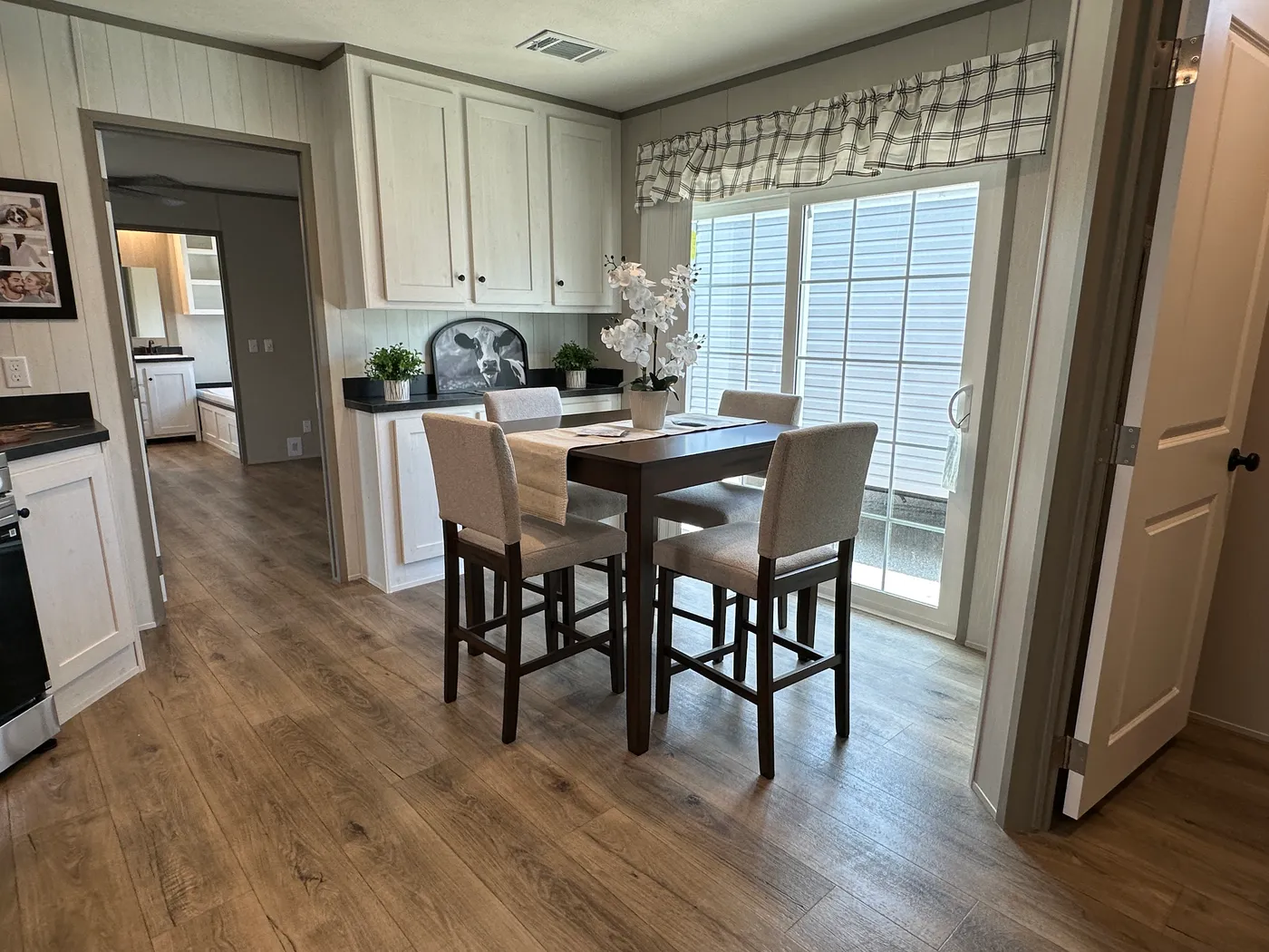 Introducing The Harvest, a beautiful 3 bedroom, 2 bathroom manufactured home with 1,216 sq. ft. of comfortable living space. This home is packed with popular upgrades, including a stainless steel farmhouse sink, a spacious kitchen design, built-in entertainment system, and upflow vents for added comfort and better furniture placement.

The private primary suite features a large garden soaking tub and separate walk-in shower, giving you the perfect place to relax after a long day. On the outsid
