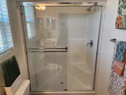 Full length shower with enclosure.