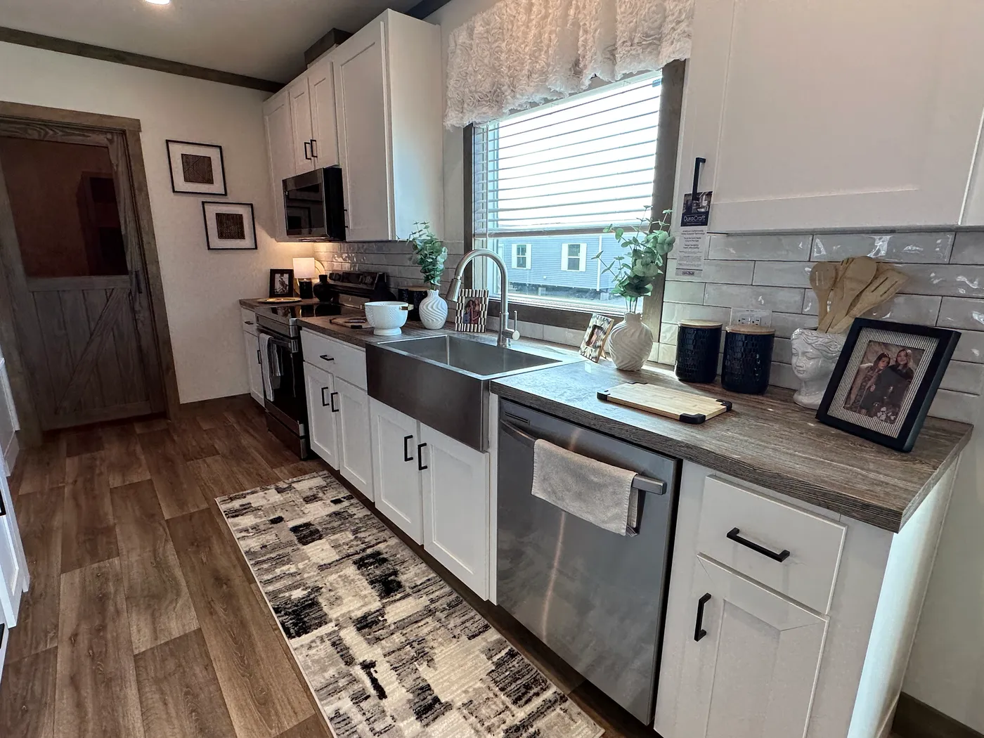 Discover The Summit, a stunning luxury doublewide manufactured home at Clayton Homes of Alvin, Texas! Designed for modern living, this beautiful home features a spacious open-concept floor plan, elegant interior finishes, and an impressive gourmet kitchen with a massive center island, stainless steel appliances, and abundant cabinet space. Enjoy generous living areas, spacious bedrooms, walk-in closets, and a luxurious primary suite designed for comfort and relaxation. Combining modern farmhouse