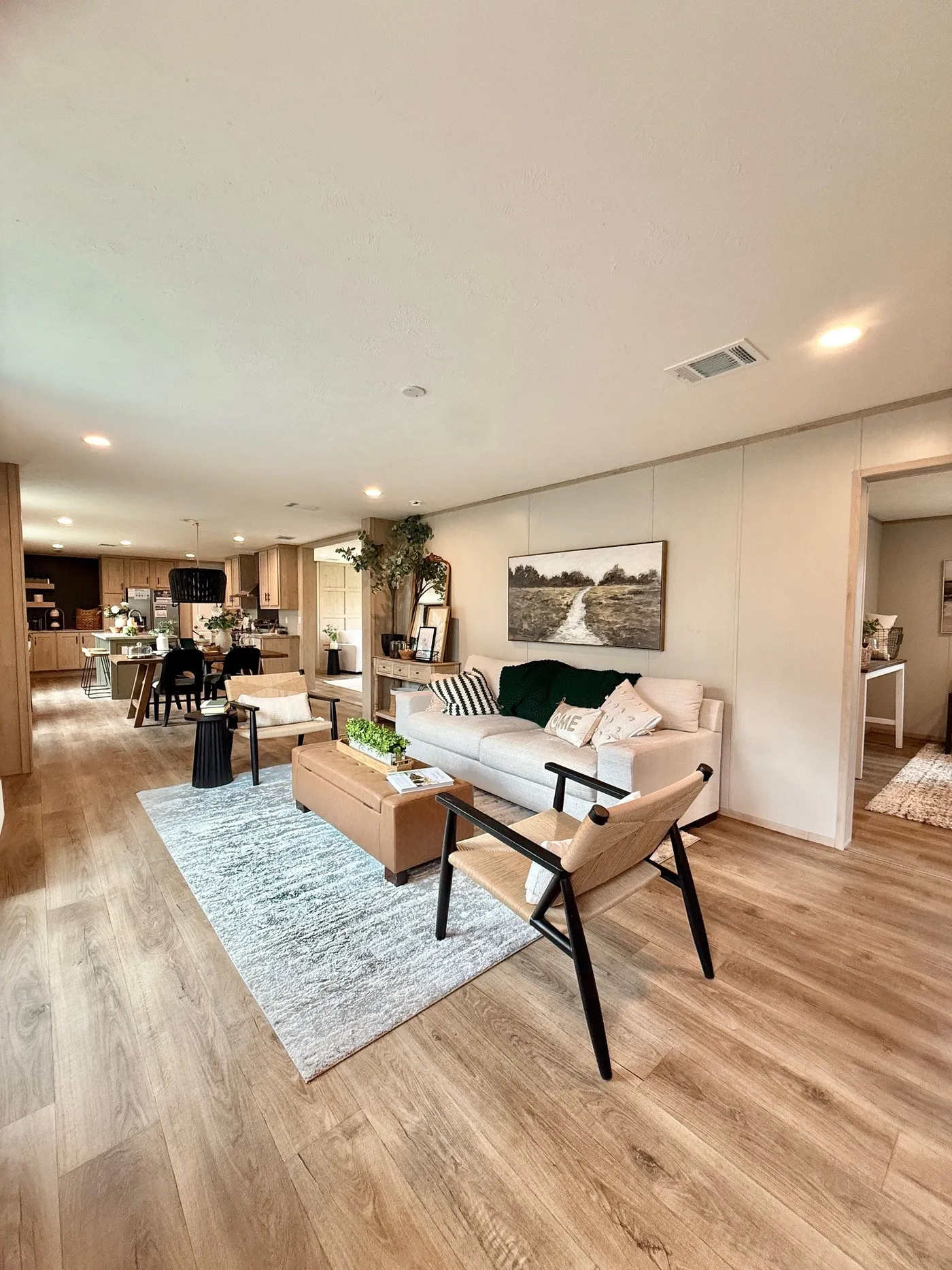 Plenty of room to relax and entertain.
This beautiful open-concept living area flows perfectly into the dining room and kitchen, creating the ideal space for family time or hosting friends.
With natural light, modern décor, and a spacious layout, this home feels bright, comfortable, and inviting the moment you walk in.