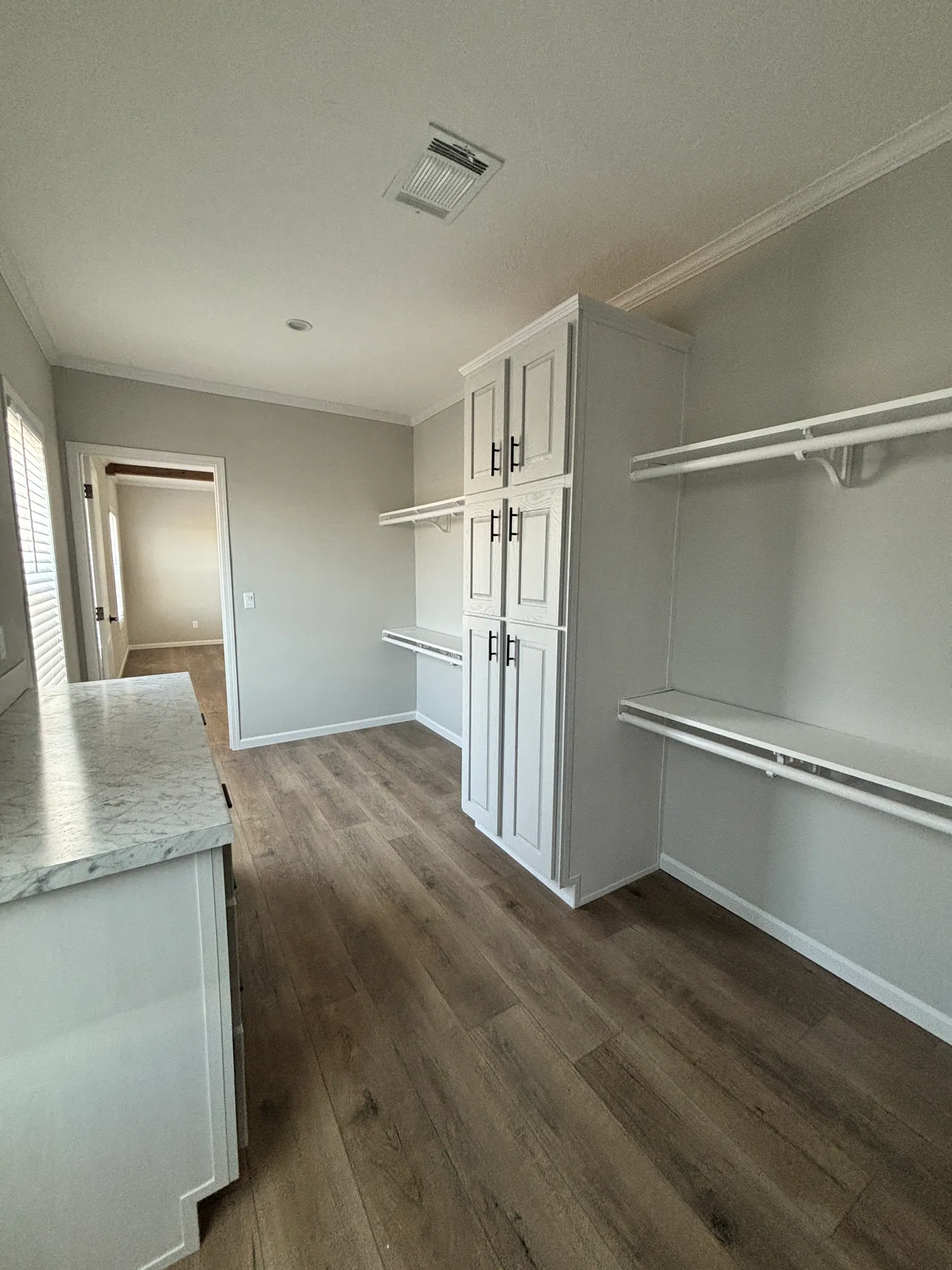 Spacious primary bedroom walk-in closet