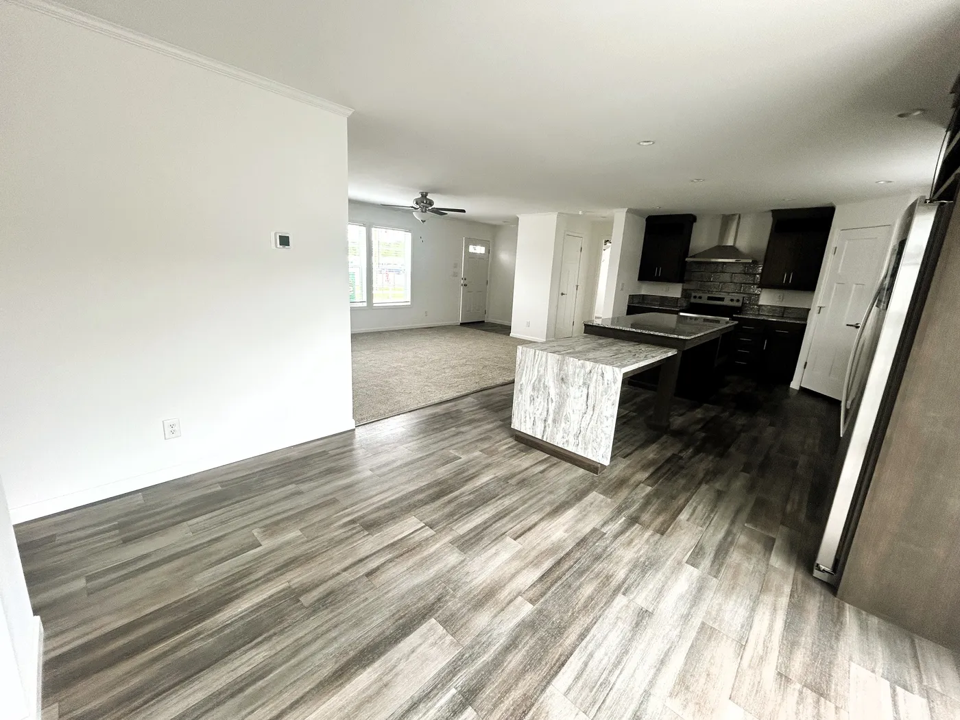 A view of the kitchen from the dining area. 