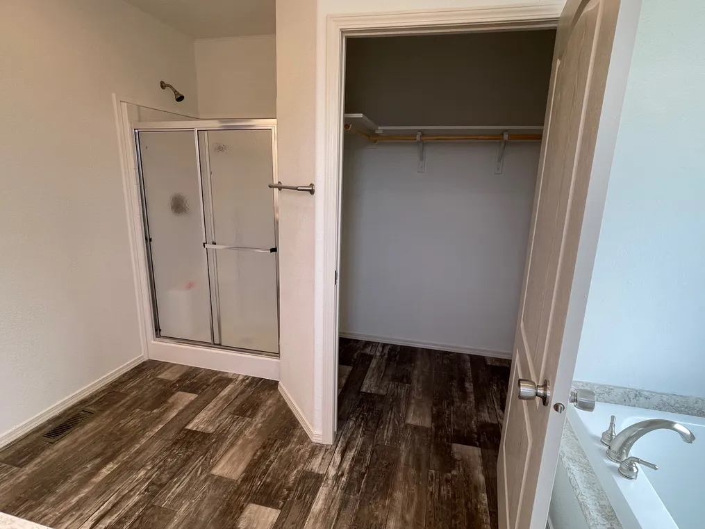 Walk-in shower and large close with built in storage.
