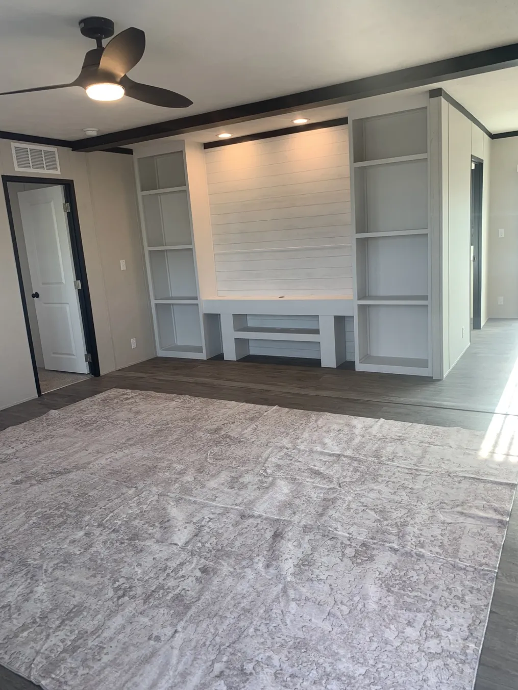 Open concept Living Room with Entertainment accent wall.
