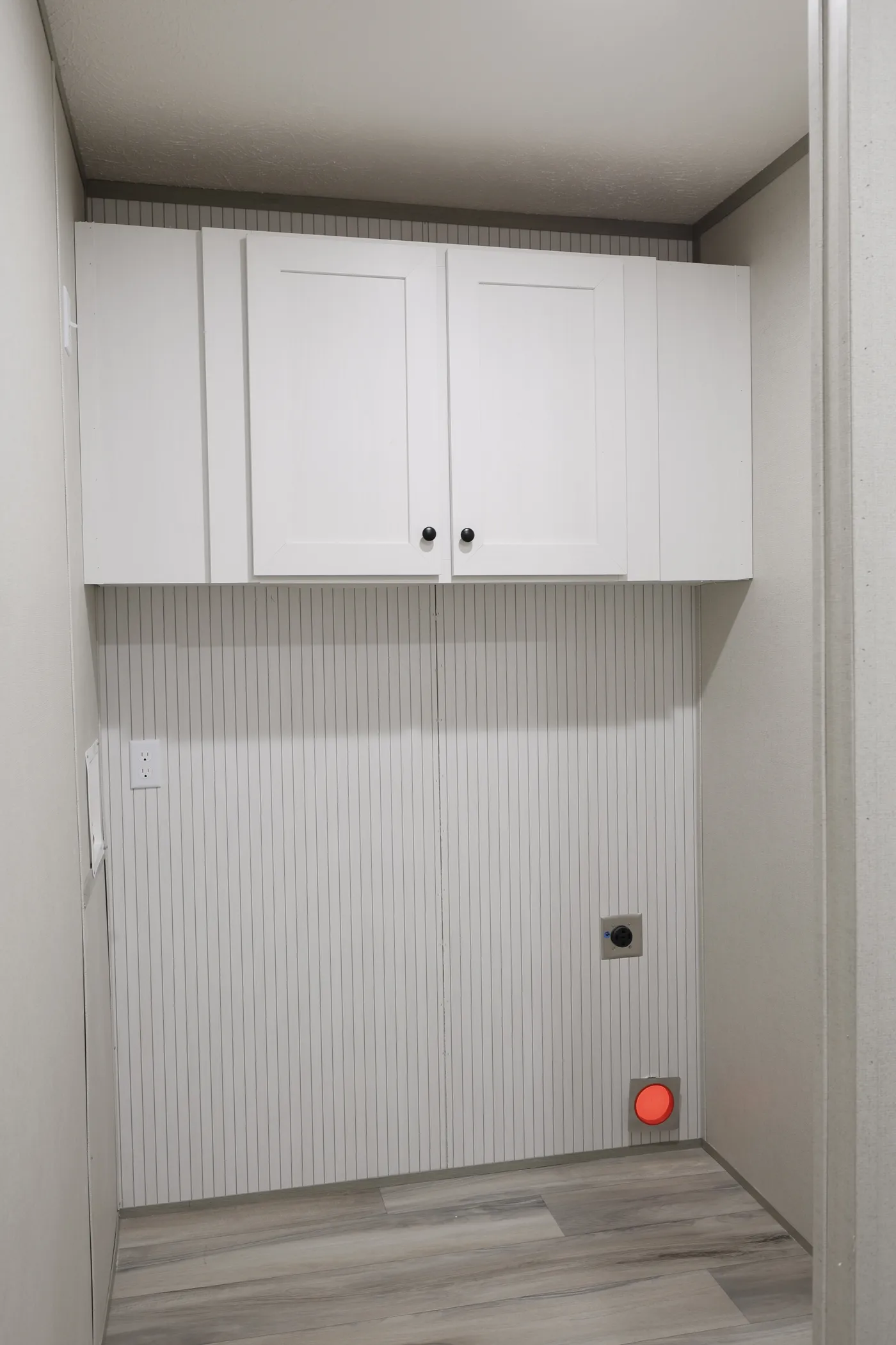 utility room is located inside of the hidden pantry