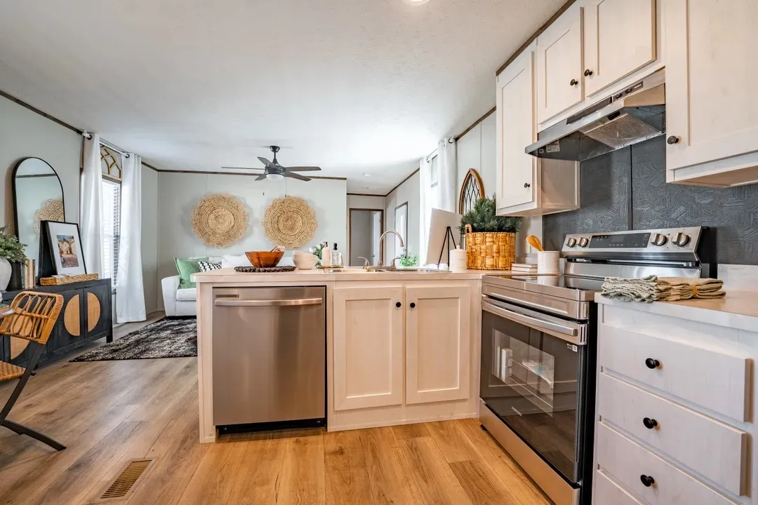 Beautiful manufactured tiny home living room and kitchen. Best deals and prices on Clayton Built manufactured home in texas.