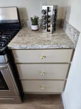 Bank of drawers included in kitchen.