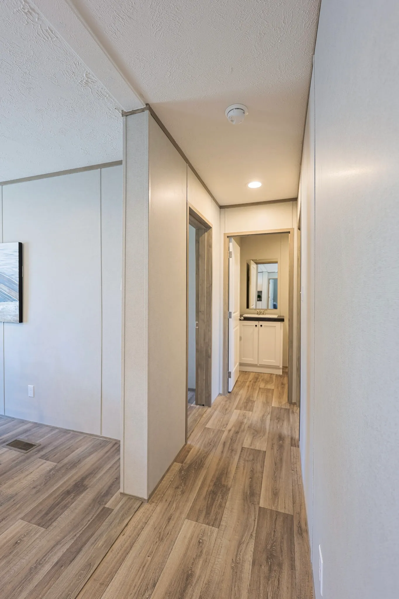hallway view from living area (goes to bedroom two and hallway bathroom)