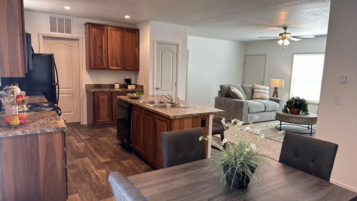 Open kitchen with LED lighting and island.