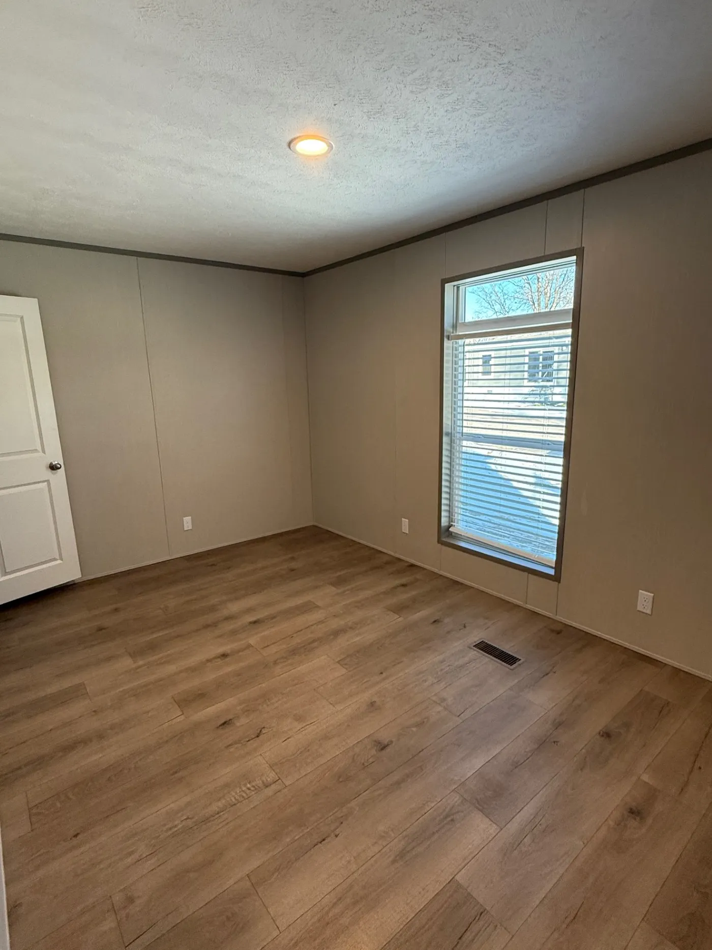 Nice sized guest bedroom with large window