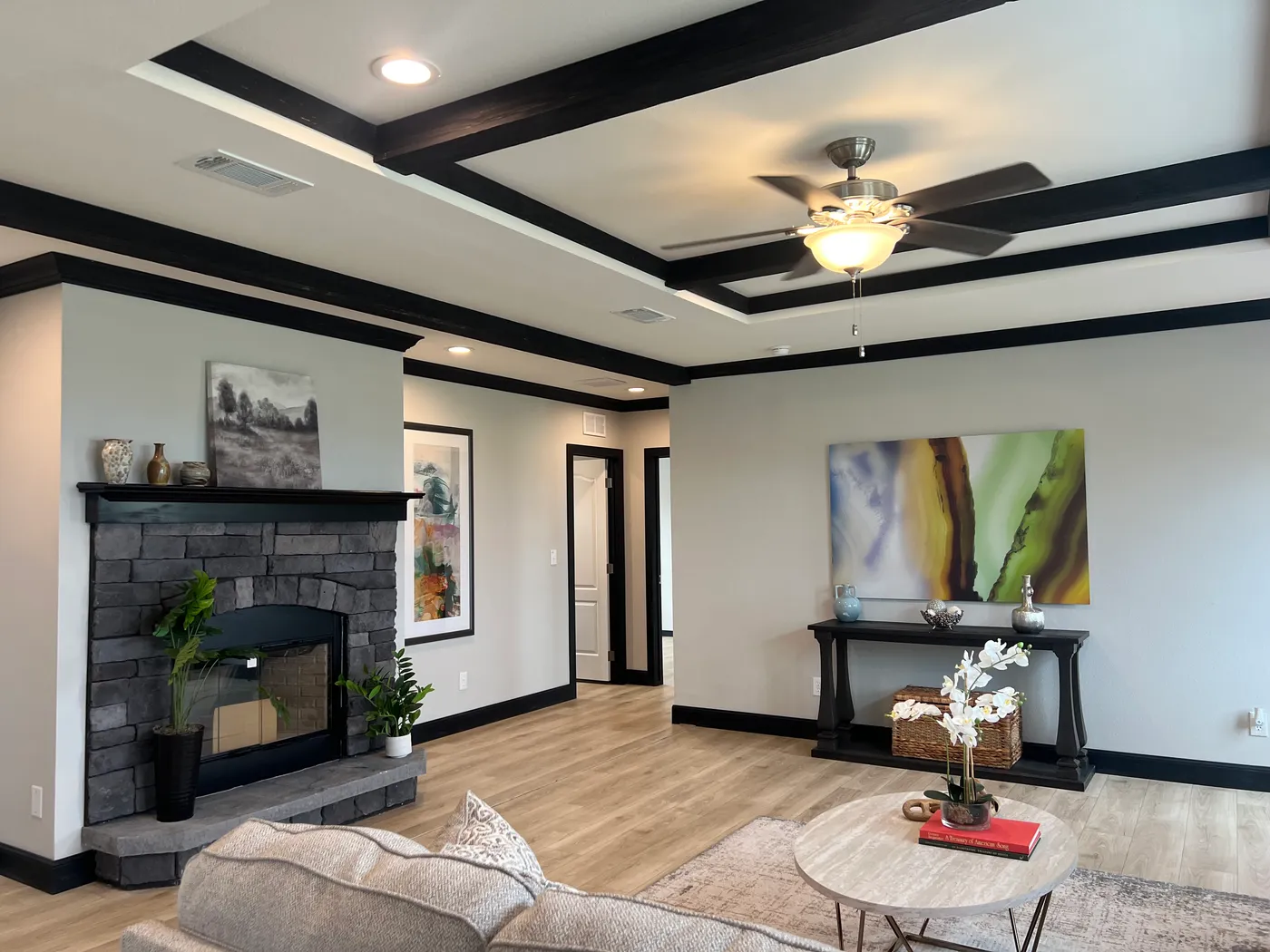 Beautiful tape and texture manufactured home living room with 9 foot tray ceiling . Best deals and prices on affordable, quality, Clayton Built manufactured home in texas.