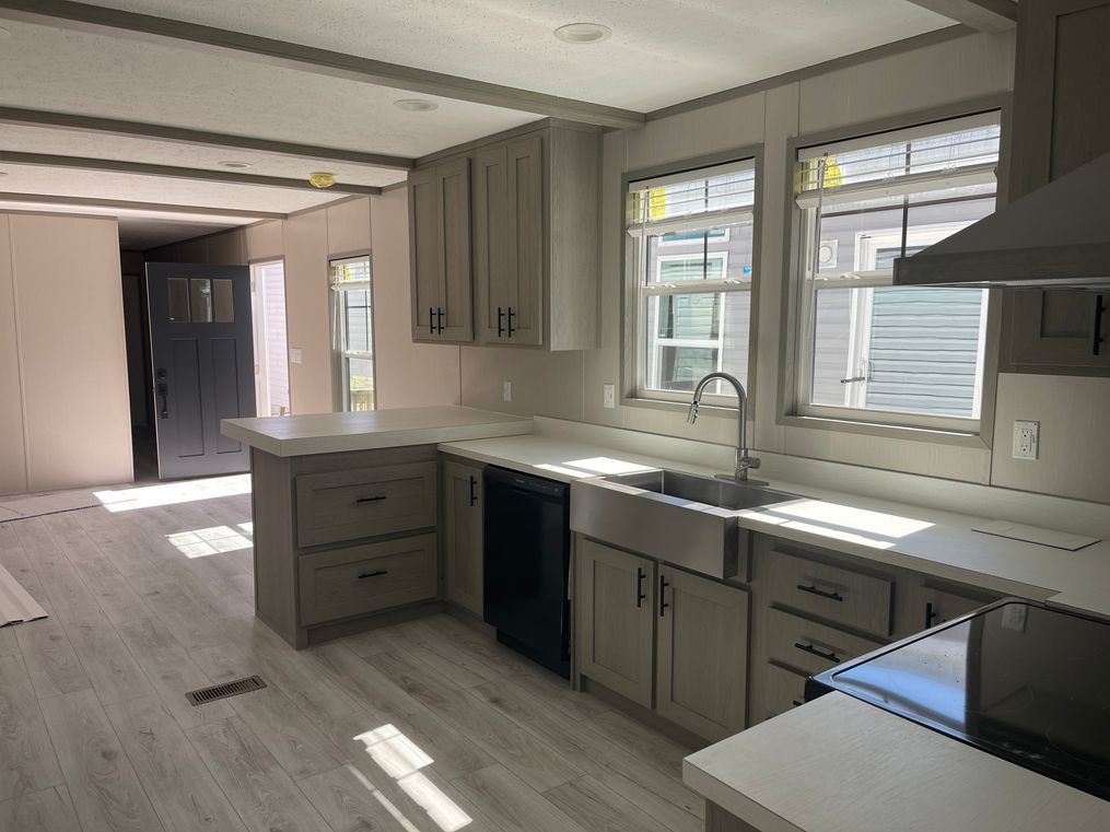 Stainless steel farmhouse sink and lots of countertops space 