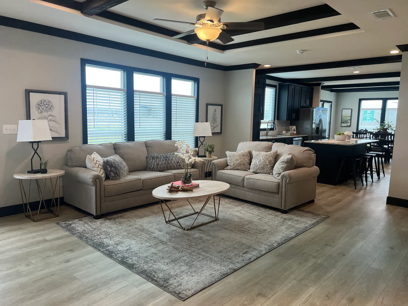Beautiful tape and texture manufactured home living room with 9 foot tray ceiling . Best deals and prices on affordable, quality, Clayton Built manufactured home in texas.