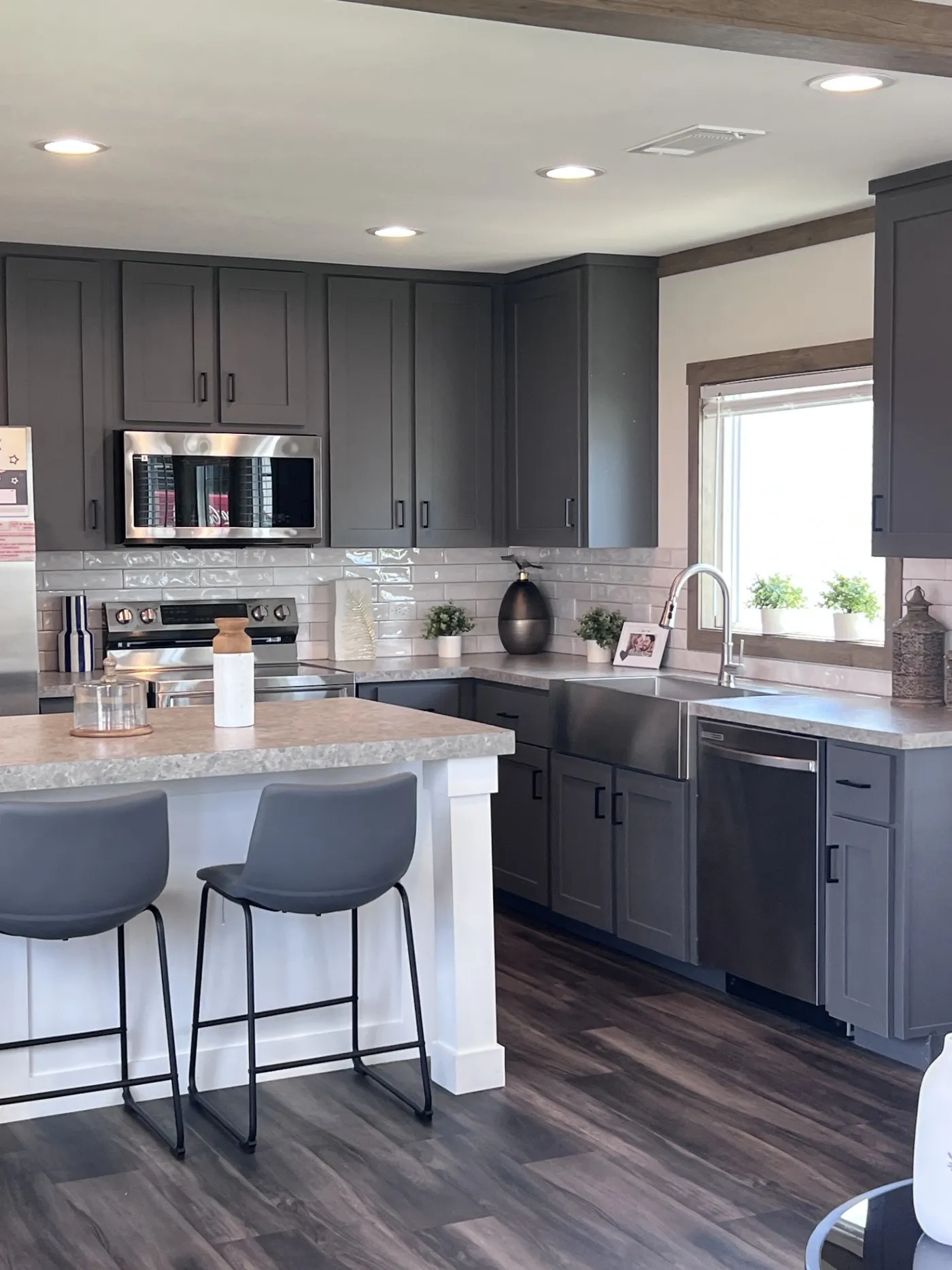 Stainless steel upgraded appliance with large deep farmhouse sink smart stove with air fryer and dehydrator beautiful view to outside from large window