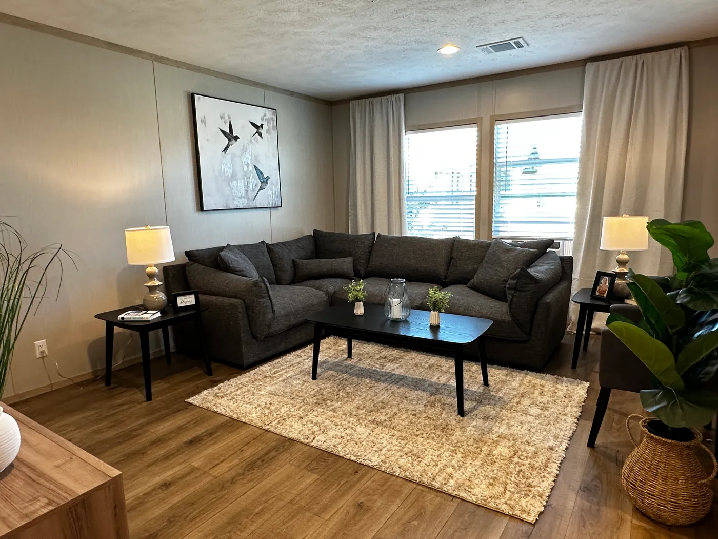 Spacious 3 bedroom, 2 bathroom double wide manufactured home built for comfort and family living. This open layout features both a living room and separate den, perfect for movie nights, entertaining, or creating private space for kids and adults. The modern kitchen includes stainless steel appliances and ample cabinet space. Enjoy year-round comfort with energy-efficient upflow ceiling vents for improved airflow. The private primary suite offers a relaxing retreat with a large soaking tub and s