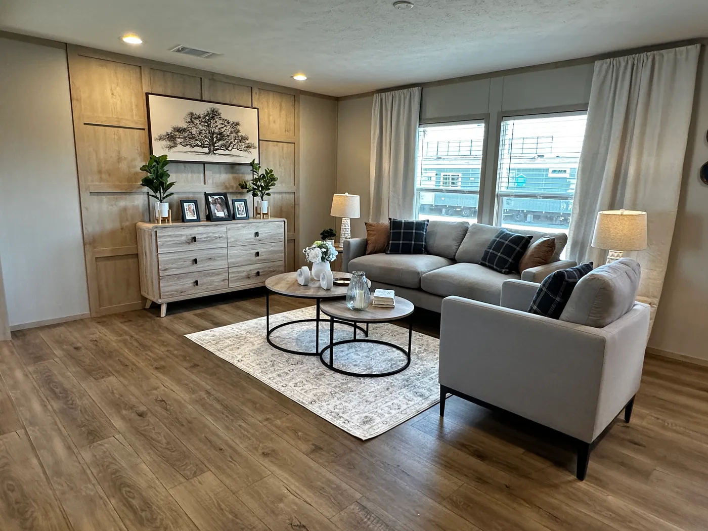 Spacious 3 bedroom, 2 bathroom double wide manufactured home built for comfort and family living. This open layout features both a living room and separate den, perfect for movie nights, entertaining, or creating private space for kids and adults. The modern kitchen includes stainless steel appliances and ample cabinet space. Enjoy year-round comfort with energy-efficient upflow ceiling vents for improved airflow. The private primary suite offers a relaxing retreat with a large soaking tub and s