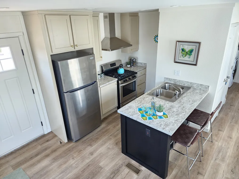 Snack bar in kitchen, refer, range and dishwasher included.