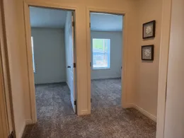 Guest bedroom access from wide hallway.