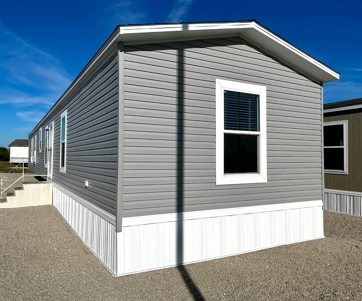 Affordable luxury meets modern comfort in this 3 bedroom, 2 bathroom manufactured home designed for spacious living and energy efficiency. The open-concept layout features a stylish kitchen with stainless steel appliances and a large walk-in pantry for extra storage. The private primary suite includes a generous walk-in closet and a relaxing retreat feel. Enjoy improved comfort with ceiling air vents for better airflow and temperature control throughout the home. This energy-efficient home offer