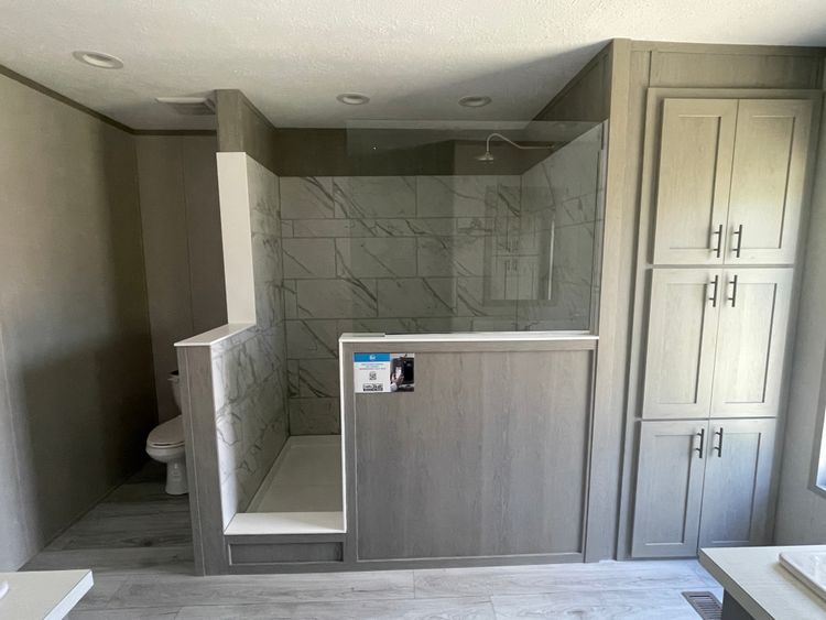 Spacious 72” tile shower and storage in the primary bathroom
