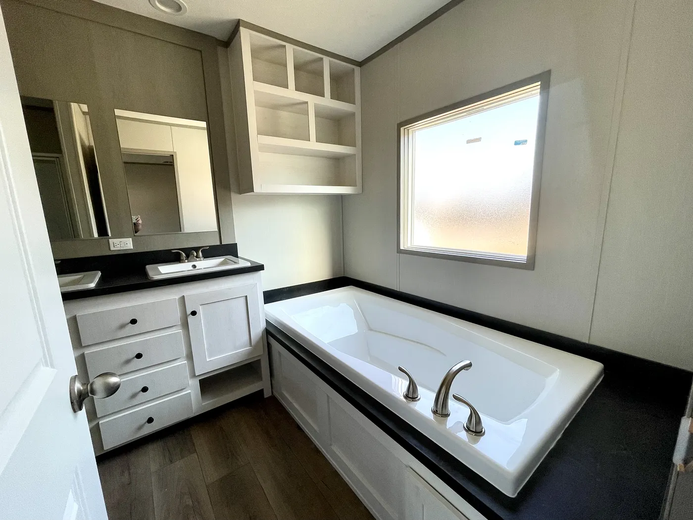 Primary Bathroom Tub / Shelving