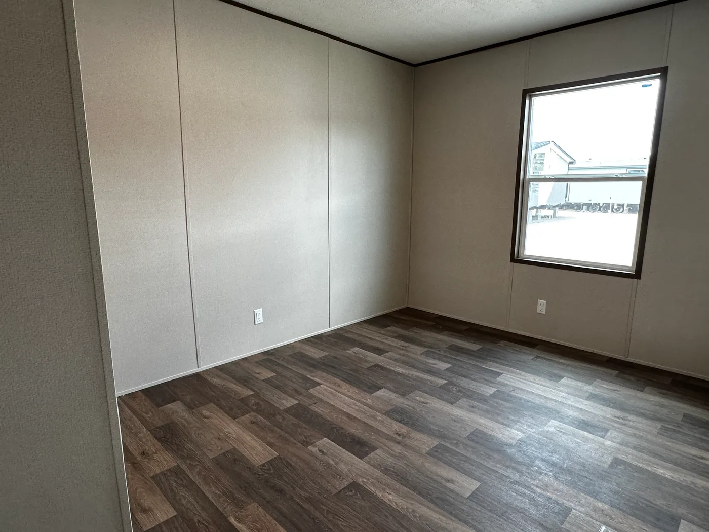 Discover the most affordable and spacious 4 bedroom, 2 bath doublewide manufactured home on the market! This budget-friendly mobile home features elevated ceilings, an open-concept layout, and plenty of room to grow with both a living room and separate den—perfect for entertaining, relaxing, or family space. The modern kitchen includes a large center island with ample storage and workspace. The private primary suite offers a walk-in closet, plus a luxury separate soaking tub and walk-in shower f