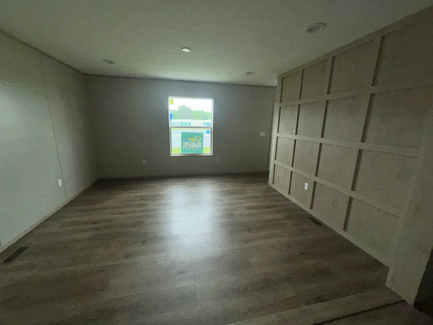 Living room with view of accent wall. 
