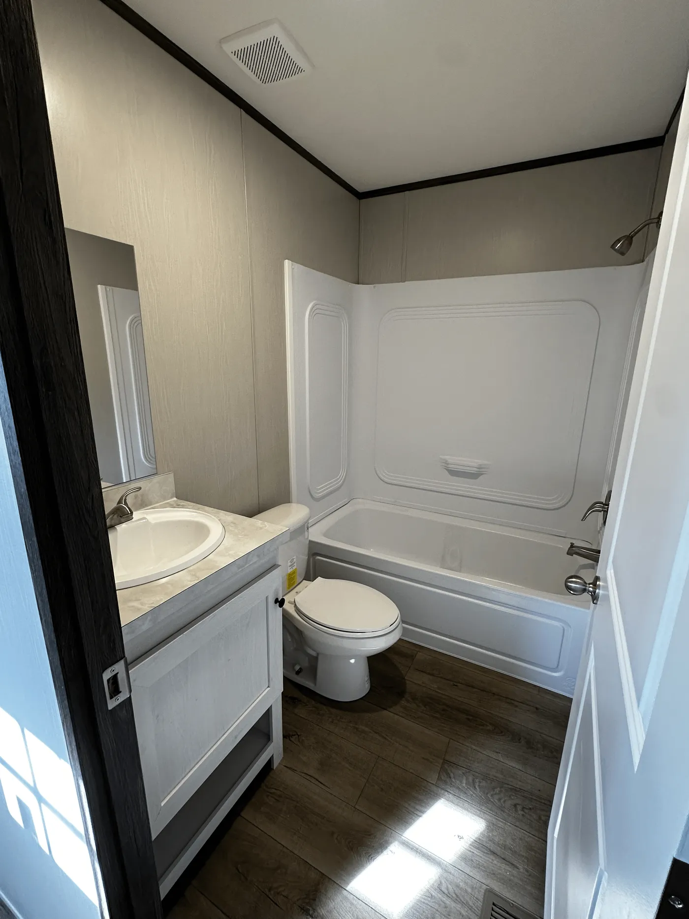 affordable manufactured home, singlewide for sale, stainless steel appliances mobile home, walk-in shower mobile home, walk-in closet master bedroom, energy-efficient mobile home, natural light mobile home, modern manufactured home, budget-friendly housing, factory-built home for sale.