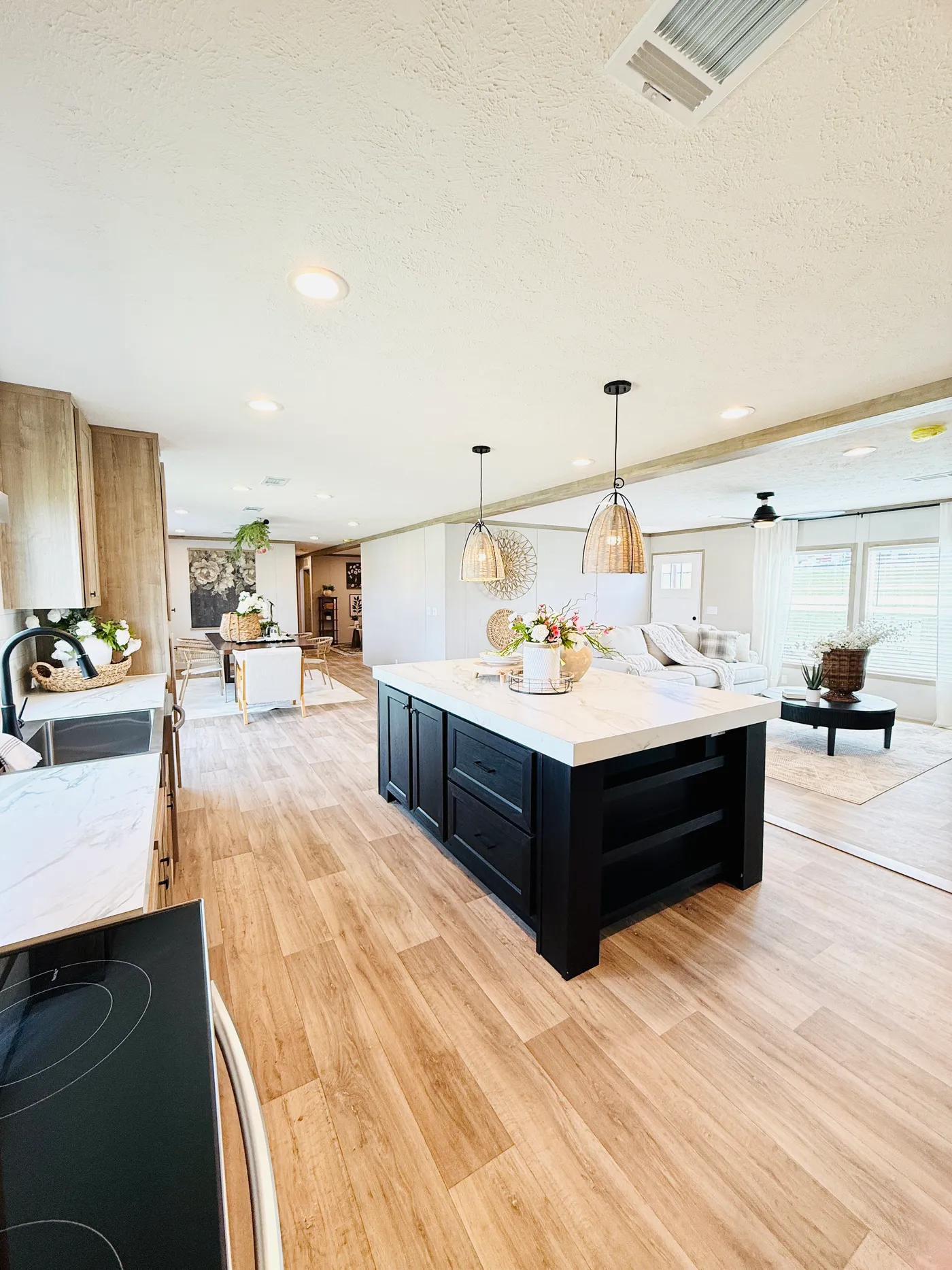 The heart of the kitchen.

This beautiful oversized kitchen island gives you plenty of space for cooking, meal prep, and gathering with family and friends. With built-in storage and stylish lighting above, it’s both functional and a stunning focal point in the home.

The open layout keeps the kitchen connected to the living and dining areas, making it perfect for entertaining and everyday living.